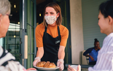 The man is eating — Eat Local. Get Rewards.