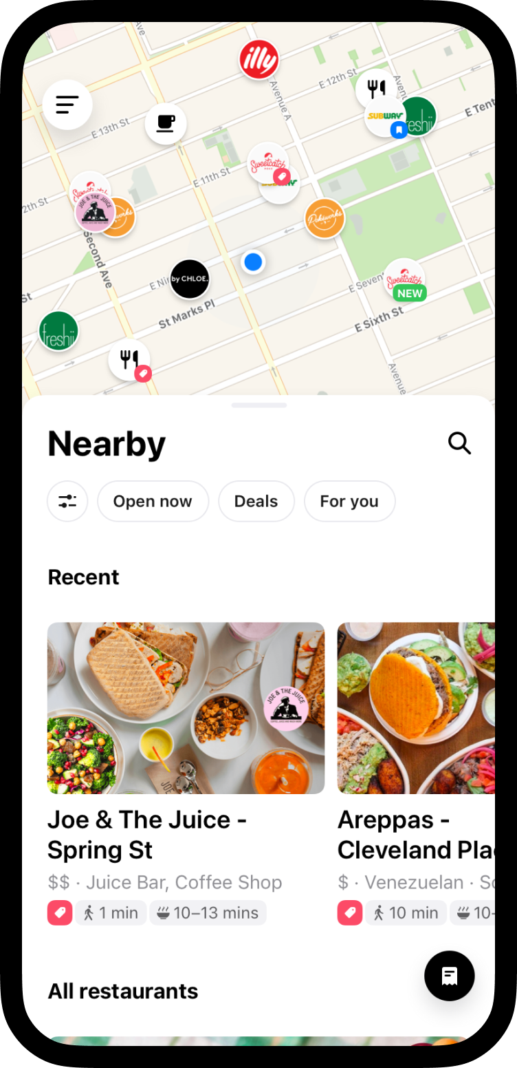 Mobile phone with At Your Door app on screen — Eat Local. Get Rewards.